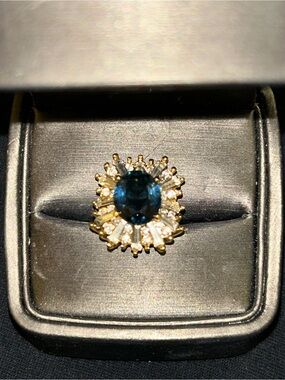 Gold Ring with Deep Blue Centerstone and Clear Baguette Halo